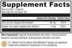 Close-up of Zinc+Copper supplement capsules in XYMOGEN bottle