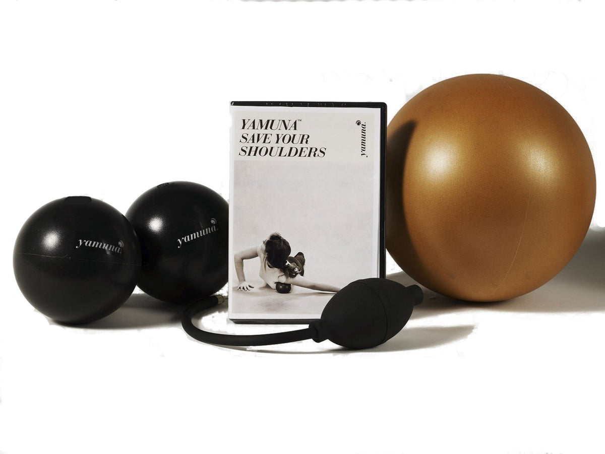 Compact Yamuna shoulder relief kit with black massage balls for portable therapy