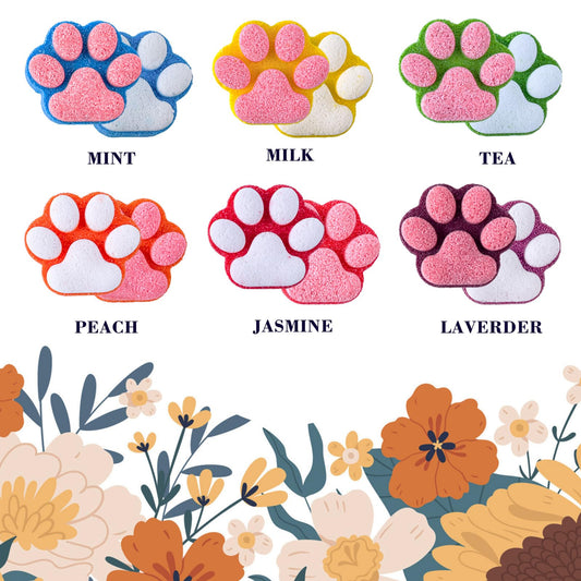 Yekery paw bath bombs being opened to reveal a surprise toy inside.