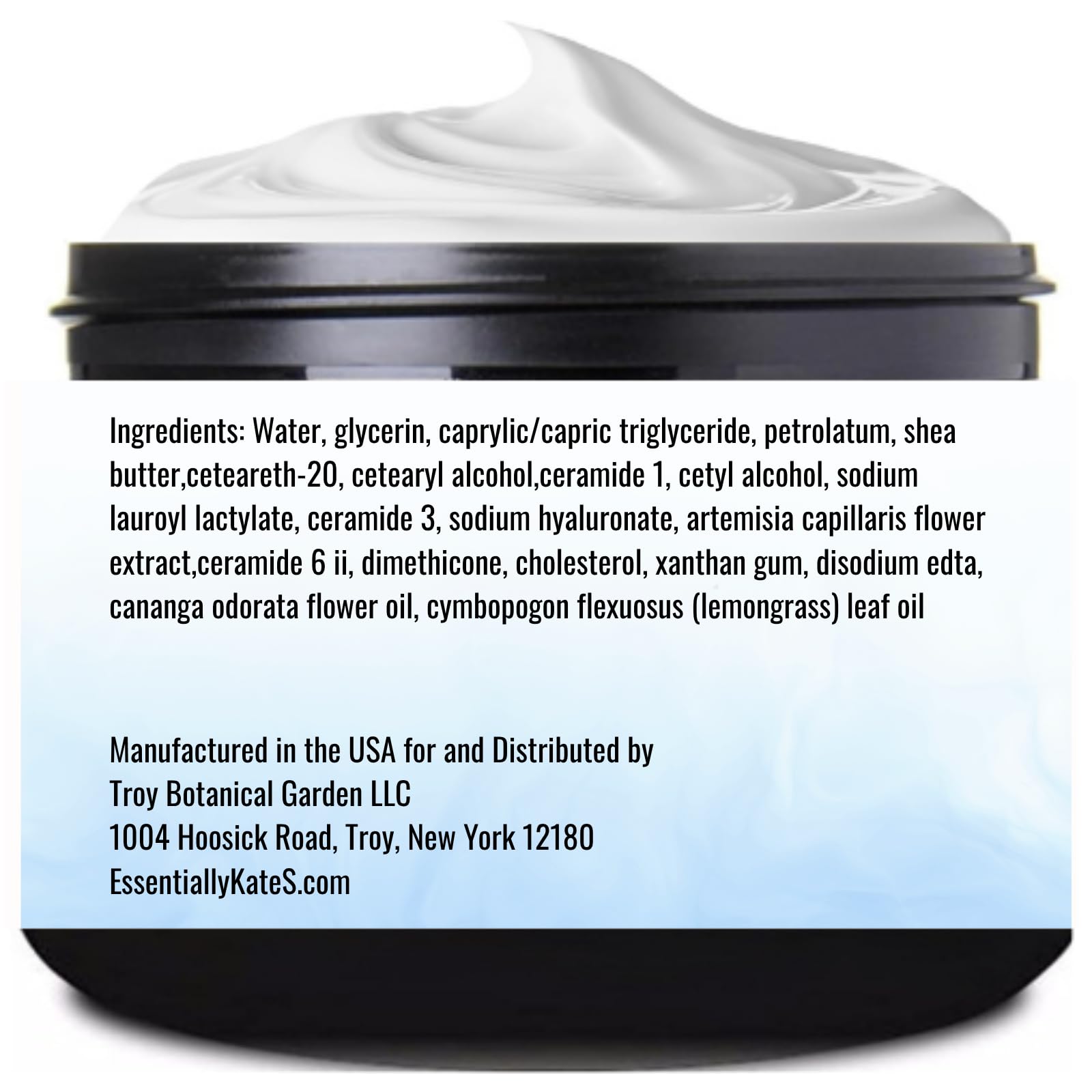 Cream lotion bottle with ylang ylang and lemongrass botanicals