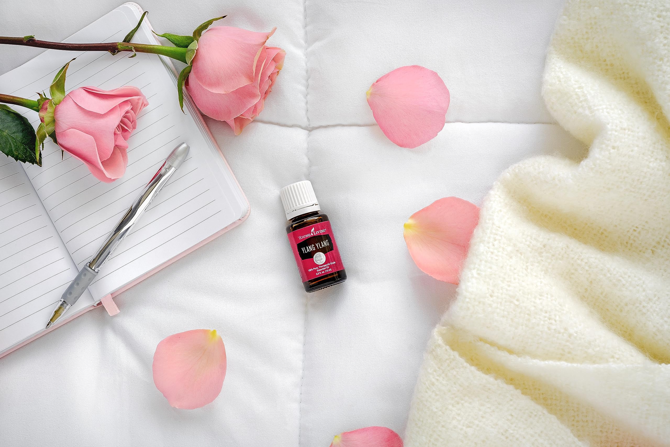 Young Living Ylang Ylang oil sealed cap closeup for premium freshness.