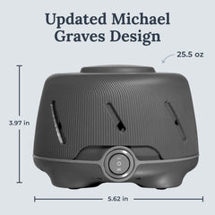 Yogasleep Dohm Charcoal travel-size on a bedside table for travel-friendly noise.