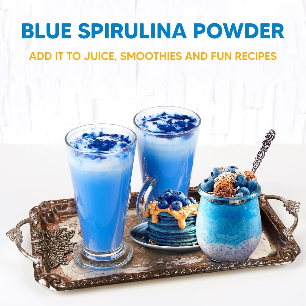 Blue spirulina powder being added to a smoothie