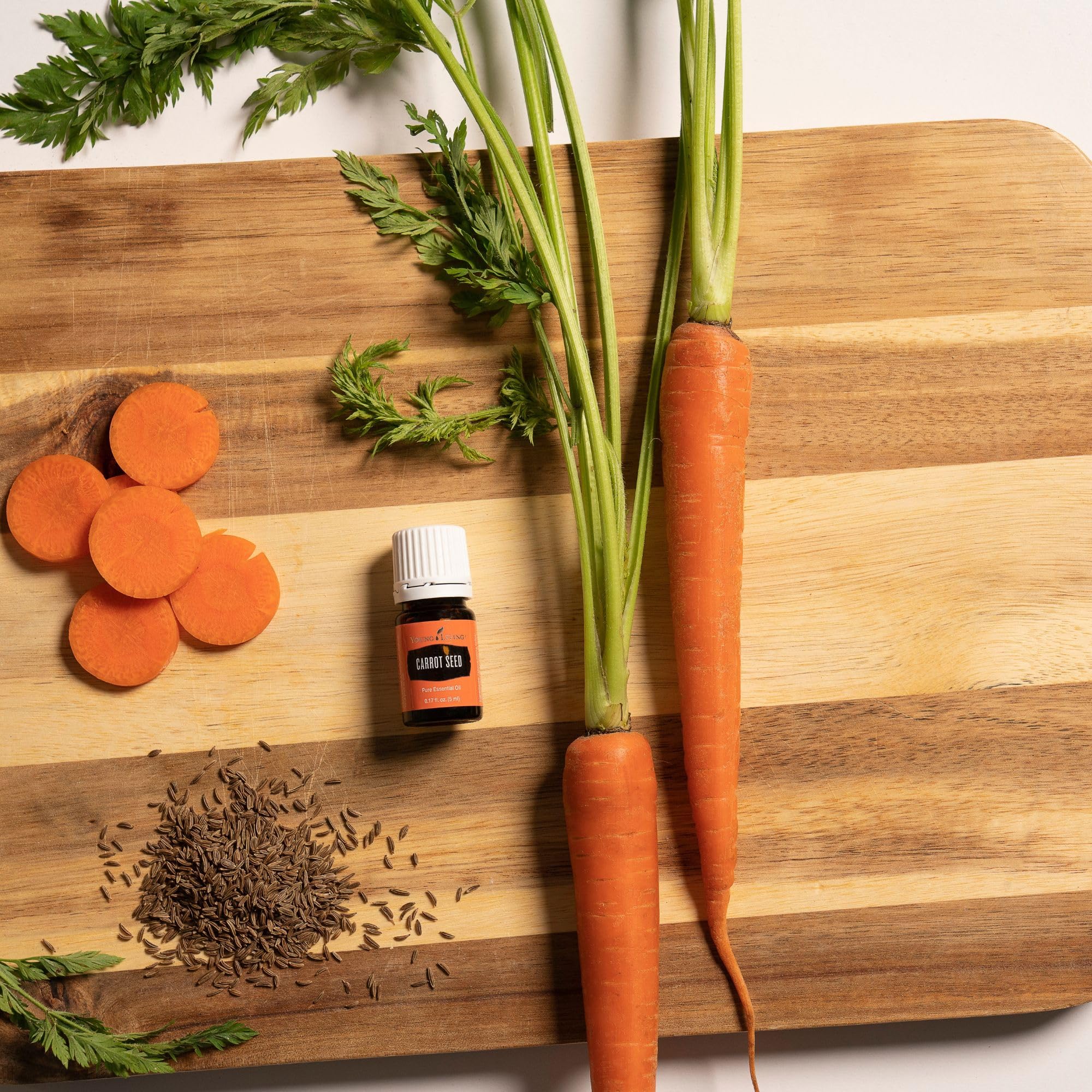 Young Living Carrot Seed Oil dropper-top closeup showcases purity for daily skincare.