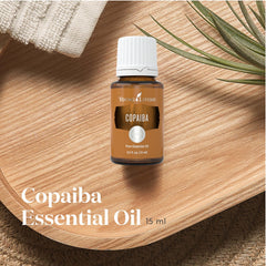 Young Living Copaiba Essential Oil diffuser scene highlights calming aroma for relaxation.