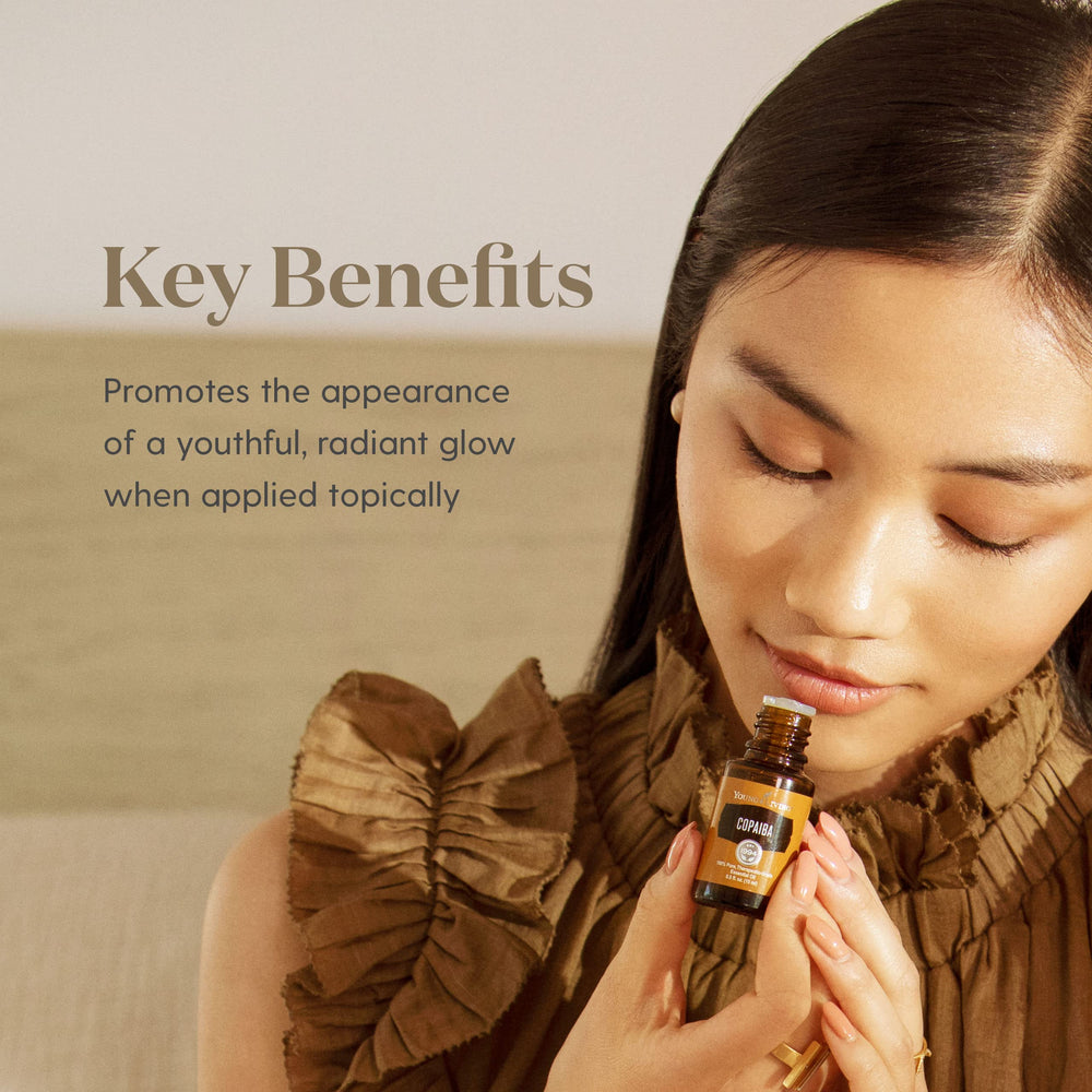 Young Living Copaiba Essential Oil on skin showcasing soothing routine benefits.