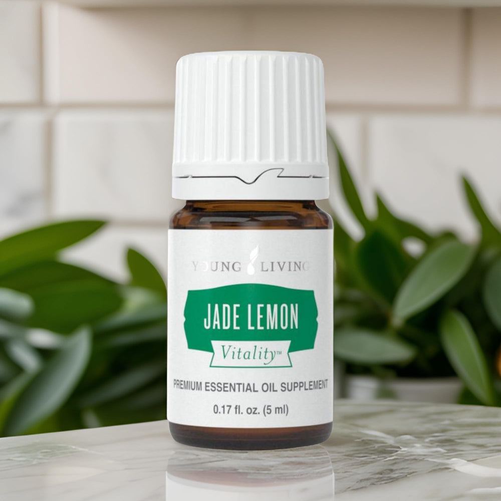 Young Living Jade Lemon Vitality bottle pour showing easy splash into beverages.