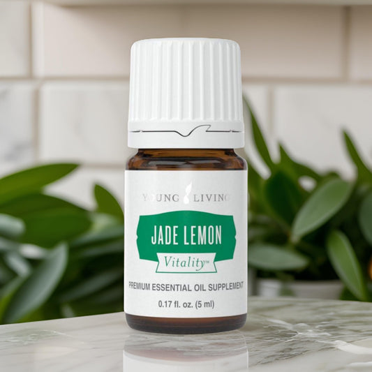 Young Living Jade Lemon Vitality bottle pour showing easy splash into beverages.