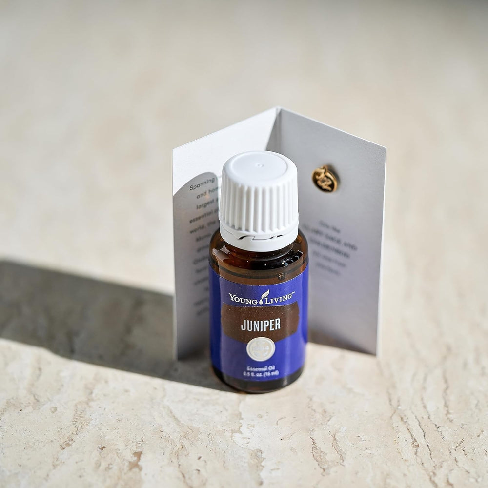 Young Living juniper essential oil woody aroma fills room ambiance.