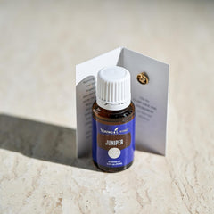 Young Living juniper essential oil woody aroma fills room ambiance.