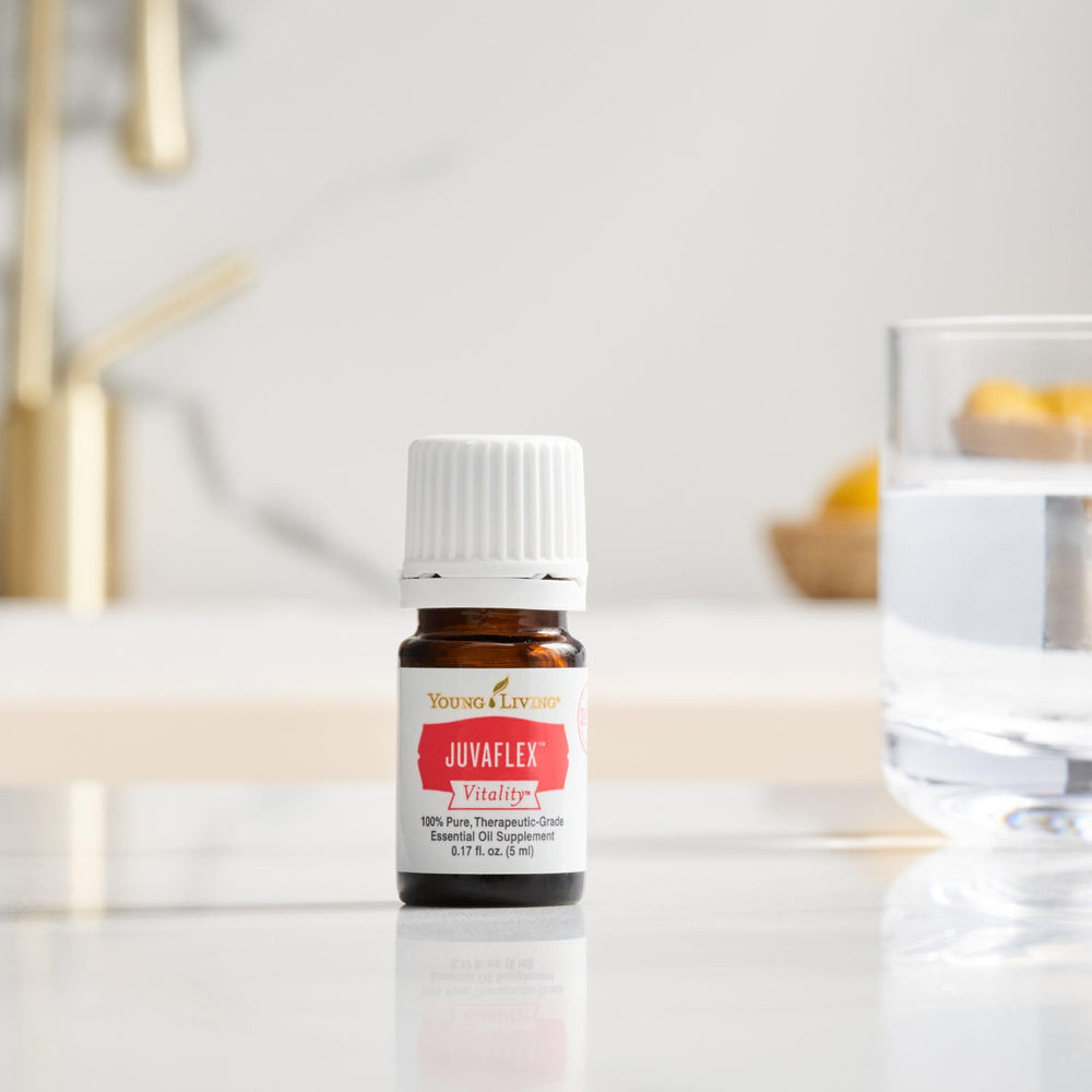 Young Living JuvaFlex Vitality dropper close-up suggests gentle, natural nourishment for digestion.