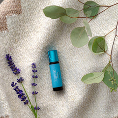 Young Living KidScents SniffleEase roll-on application image demonstrates convenient travel-friendly use.