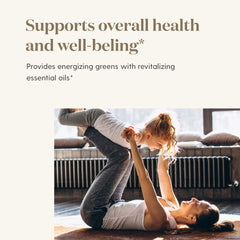 Young Living MultiGreens bottle on table for everyday wellness routine.