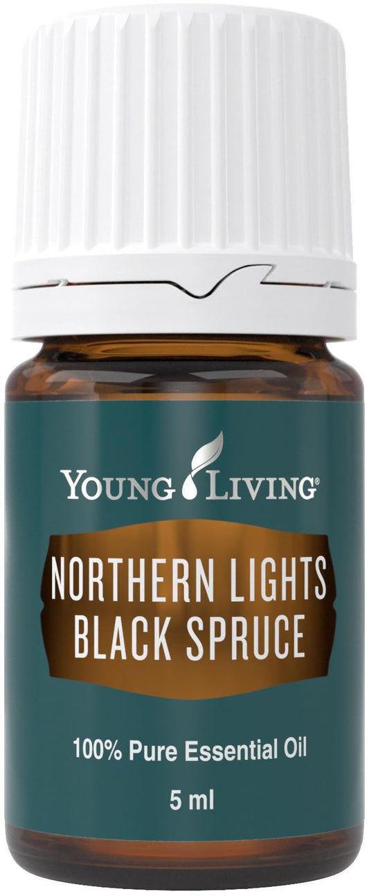 Young Living Northern Black Spruce essential oil bottle pour highlighting fresh evergreen aroma for grounding.