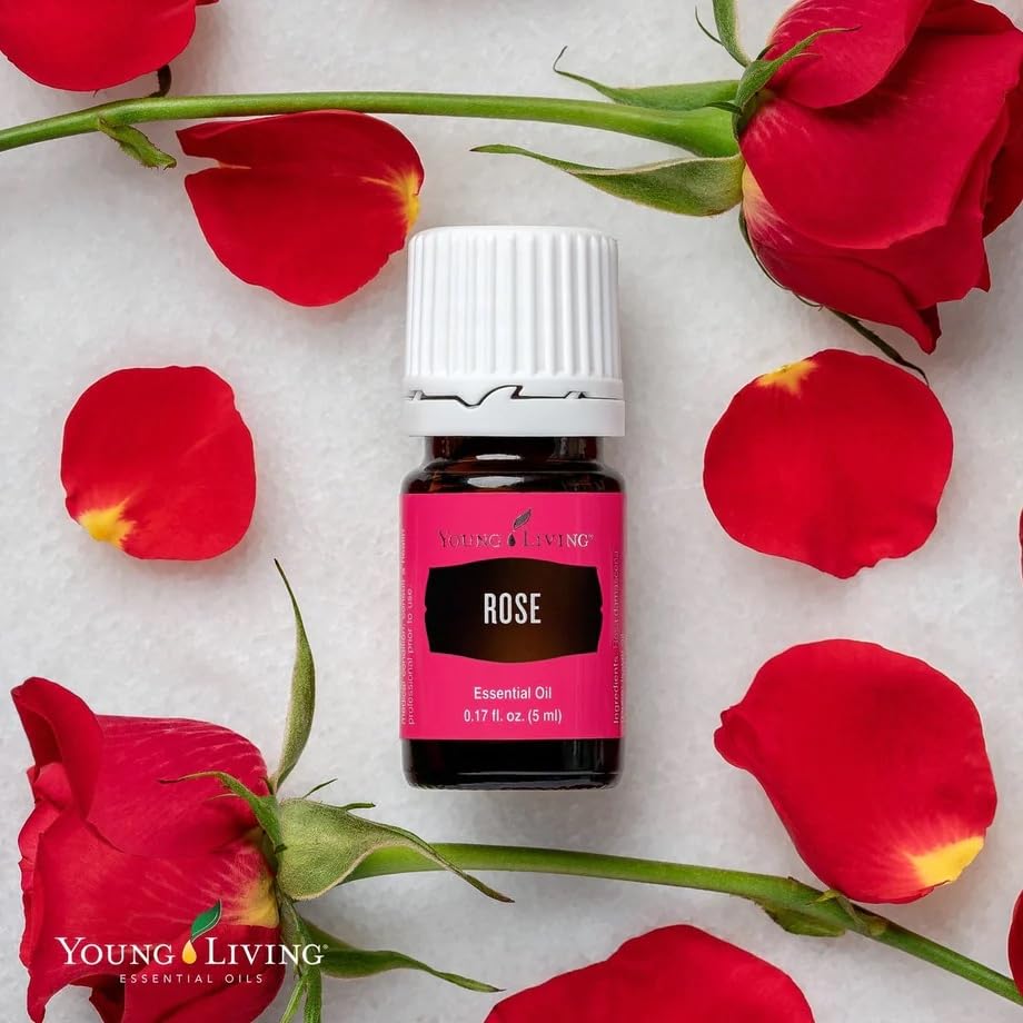 Young Living Rose Essential Oil with rose petals, ideal for relaxing aromatherapy