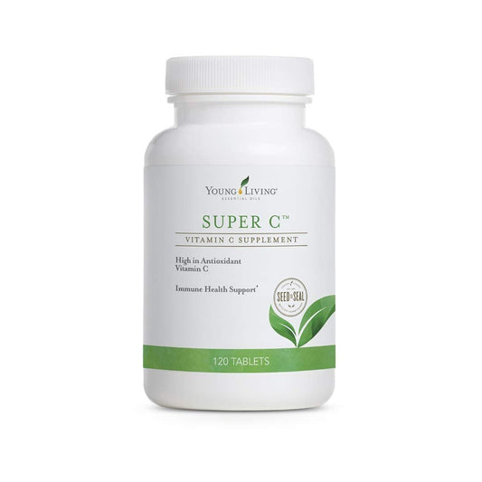 Young Living Super C tablets bottle on counter, boosting daily immune support with vitamin C.