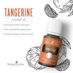 Young Living Tangerine bottle held in hand, portable and ready for travel