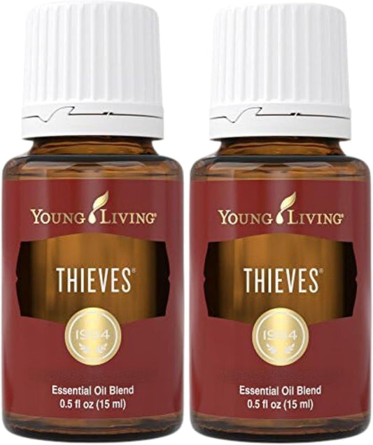 Two 15ml bottles of Young Living Thieves essential oil blend with rosemary and eucalyptus