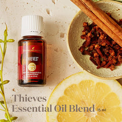 Close-up label of Thieves essential oil blend showing rosemary and eucalyptus