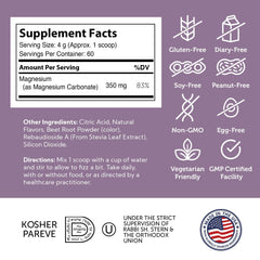 Scoop and raspberry lemon magnesium powder near a glass