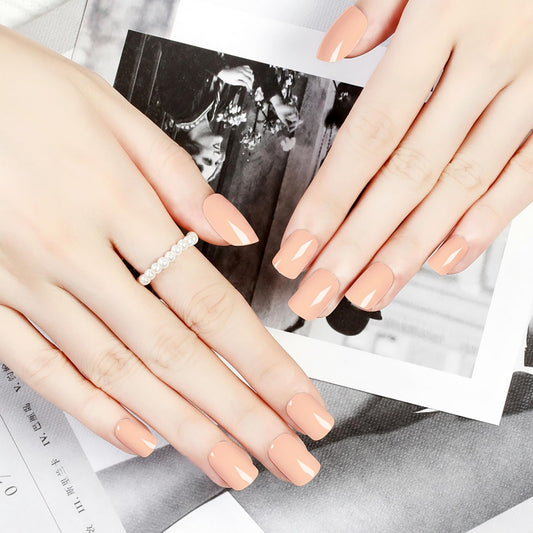 ZANVIA nude-peach acrylic press-on nails on hand for a natural look and quick wear