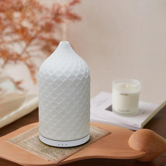 Close-up of white ceramic top cover on ZEIGGA LAB diffuser