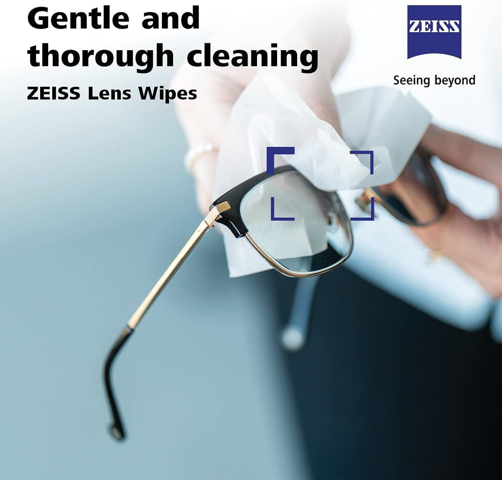 Camera lens being cleaned with ZEISS wipe