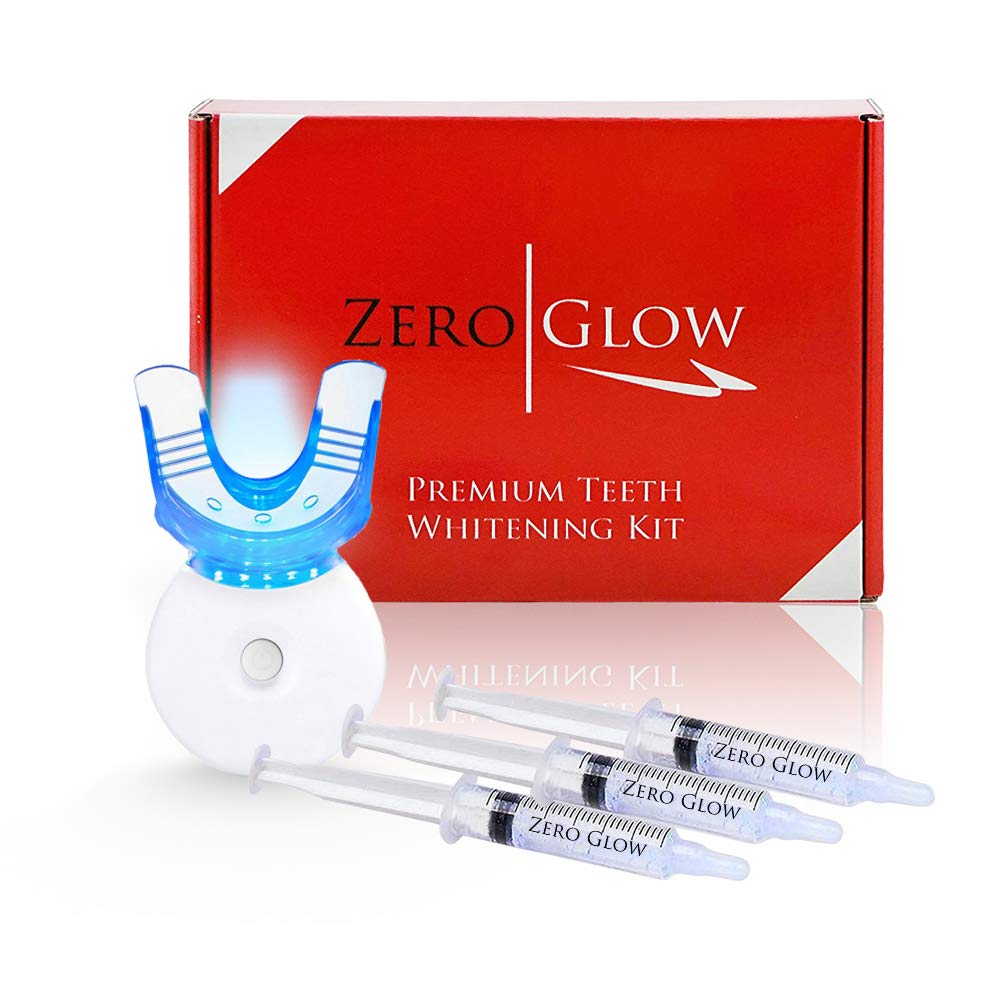Zero Glow Teeth Whitening Kit with carbamide peroxide gel syringes, mouthpiece, and LED light