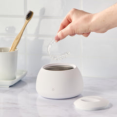 Dentures cleaned by ultrasonic cleaner in Zima Pod