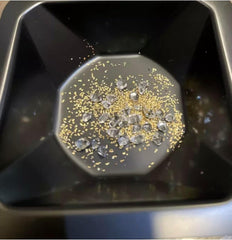 Contents of Zurjy Paydirt bag showing gold flakes